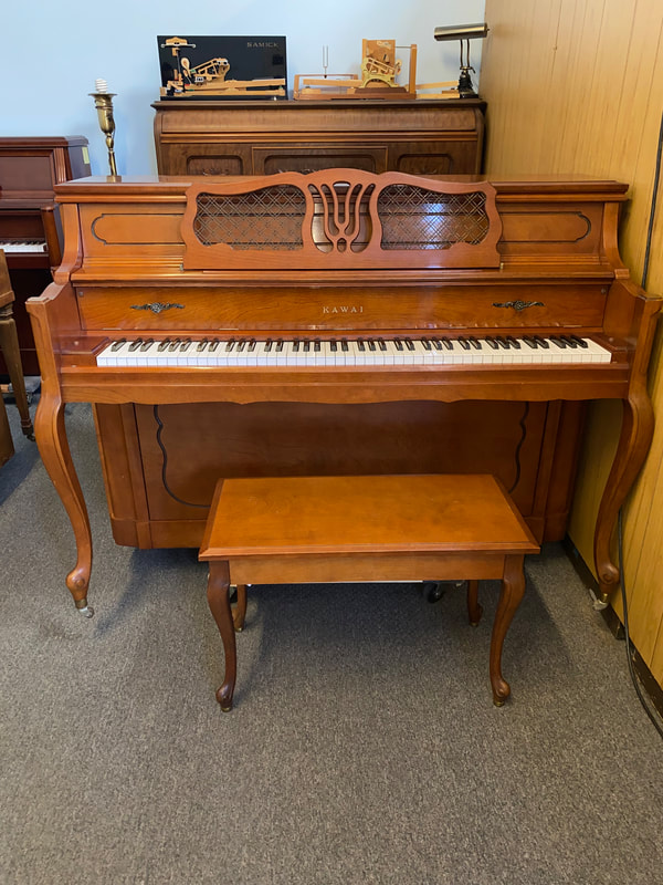 Kawai console upright piano